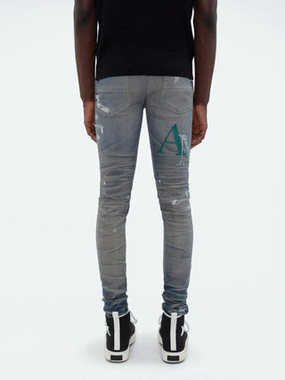 Amiri Leather Staggered Logo Jeans in Blue