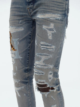 Amiri Leather Staggered Logo Jeans in Blue