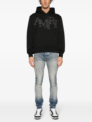 Amiri Staggered Logo Hoodie in Black