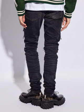 Amiri Bandana Camo Thrasher Jeans in Faded Black